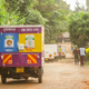 A tuk-tuk on a murram road.
